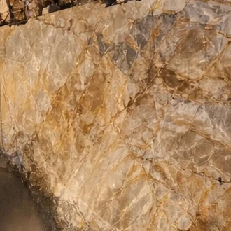 Crystalline white and gold quartzite, a freshly cut face at the quarry